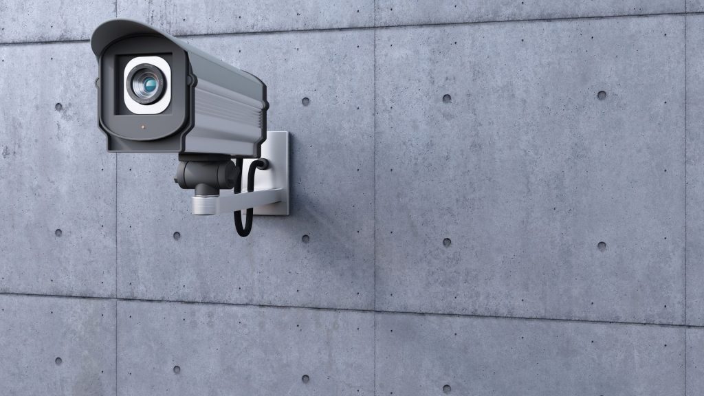 A bullet CCTV camera fixed on a wall
