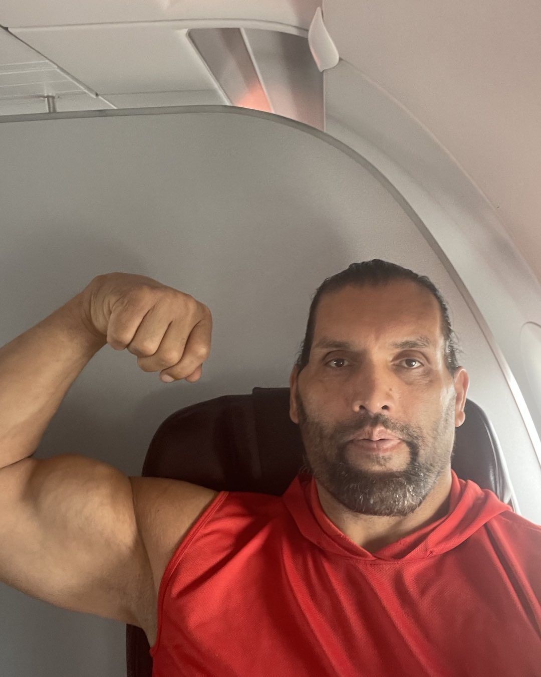 Khali showing his biceps
