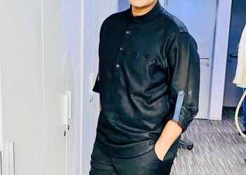 Sudhir Chaudhury in black attire - husban dof Niti Chaudhury