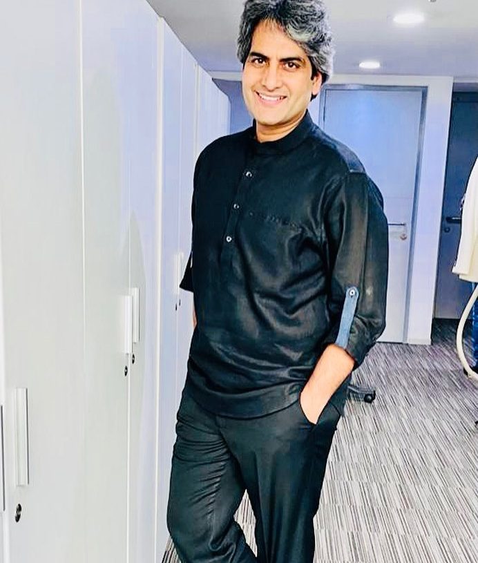 Sudhir Chaudhury in black attire - husban dof Niti Chaudhury