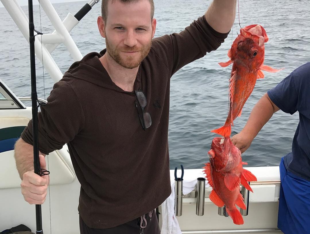 Jordan Warkol with a lobster in his hand